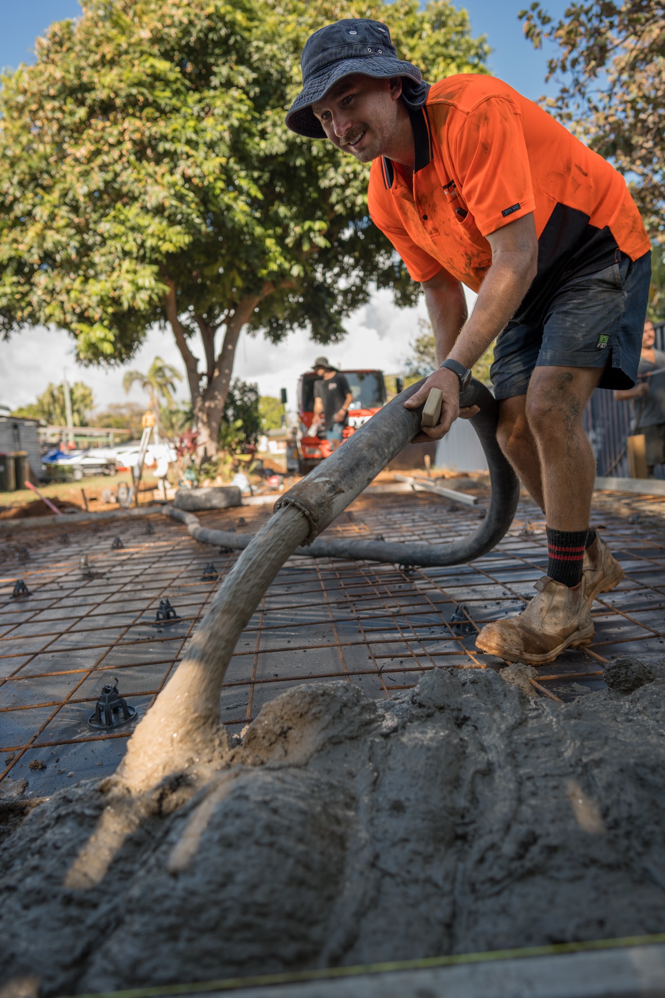 Concrete pump crew working on a residential slab